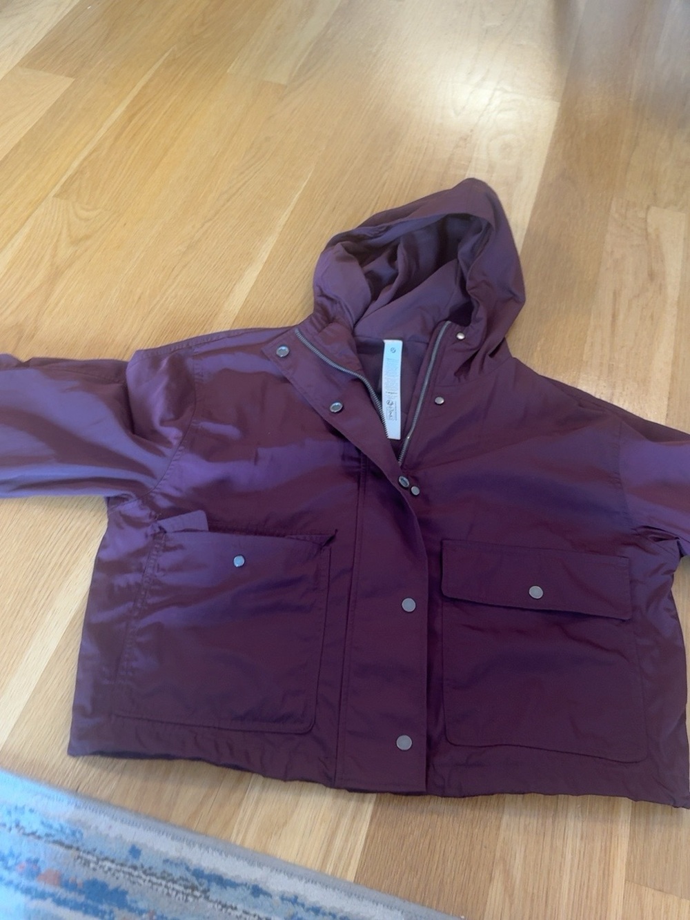 lululemon burgundy Hooded Raincoat in Plum